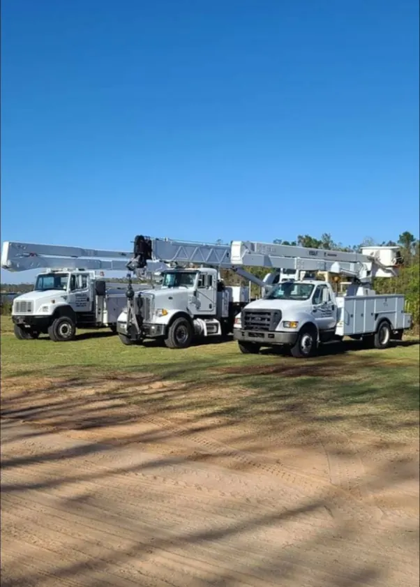Three service trucks from Bordelon's fleet
